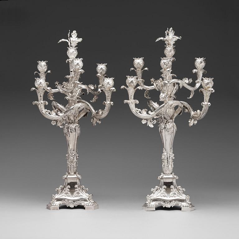 A pair of Swedish 19th century silver candelabras, marks of Gustaf Möllenborg, Stockholm 1845 and 1893.