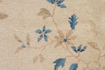 A semi-antique China/Nepal carpet, c, 385 x 297 cm.