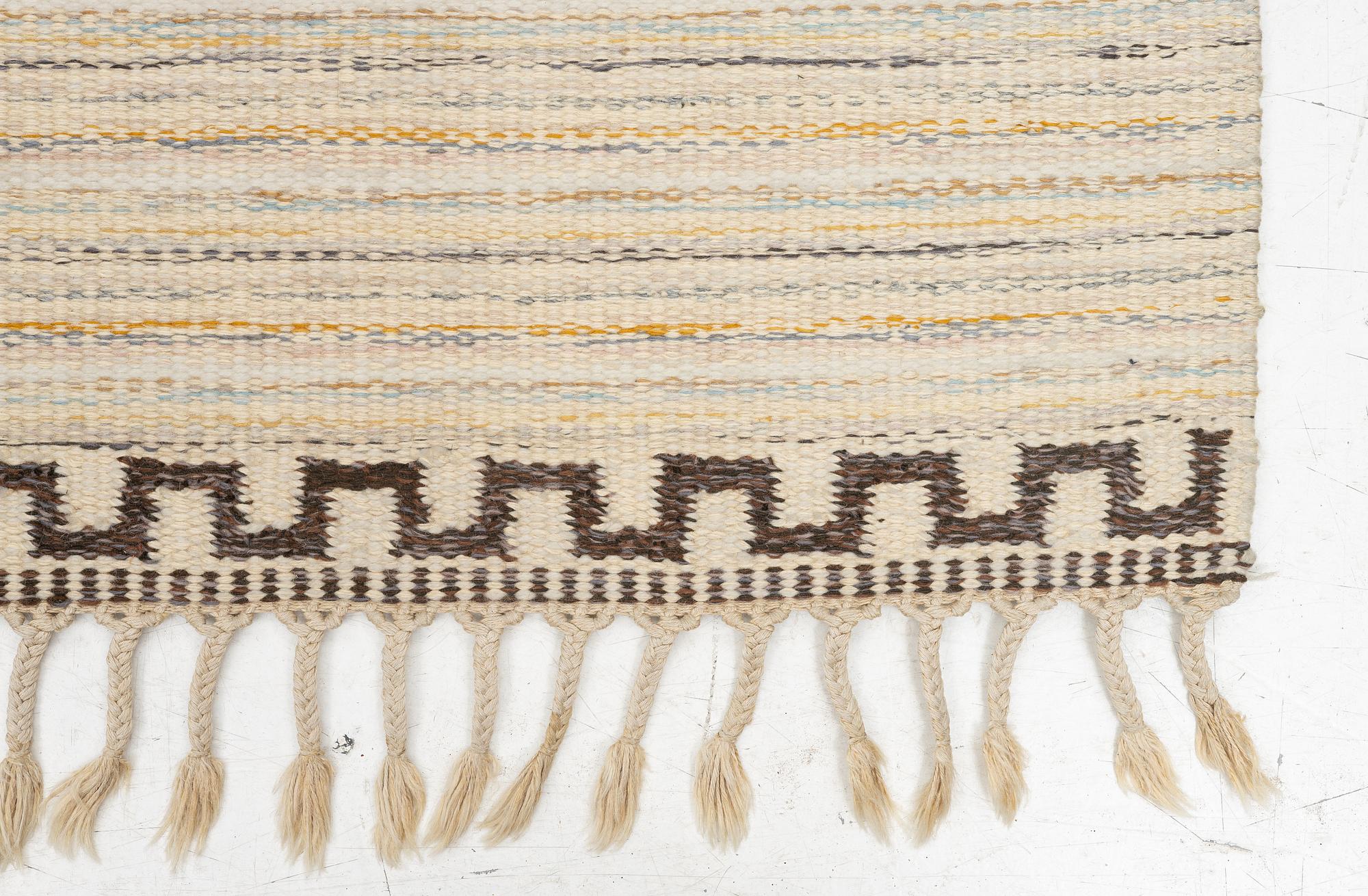 A  flat weave carpet, c. 202 x 137 cm.