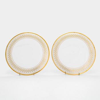 Cartier, two 'La Maison des Must' porcelain cake dishes.