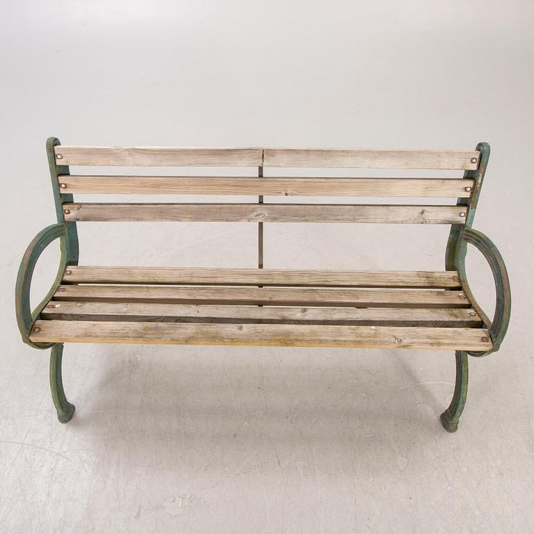 A mid 20th century metal and wood garden sofa.