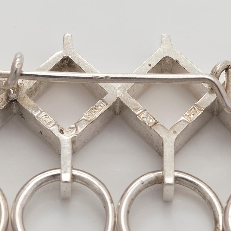 Jorma Laine, a set of two silver pendants, a bracelet and a brooch. Kultateollisuus Oy, Turku 1965-1972.