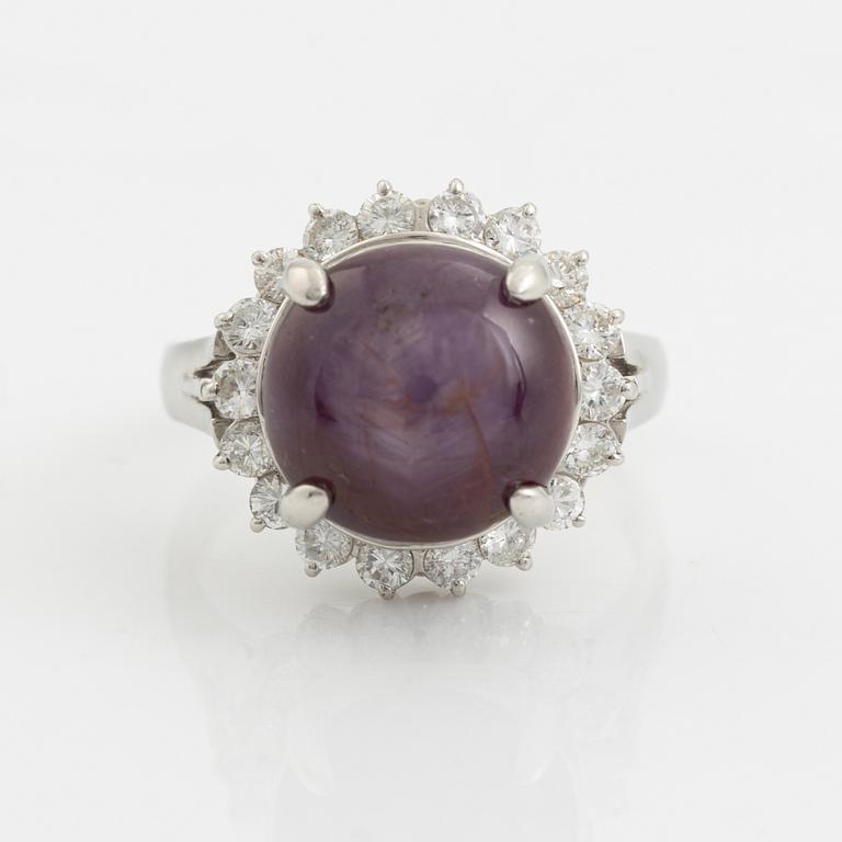 Purple star sapphire and brilliant cut diamond ring.