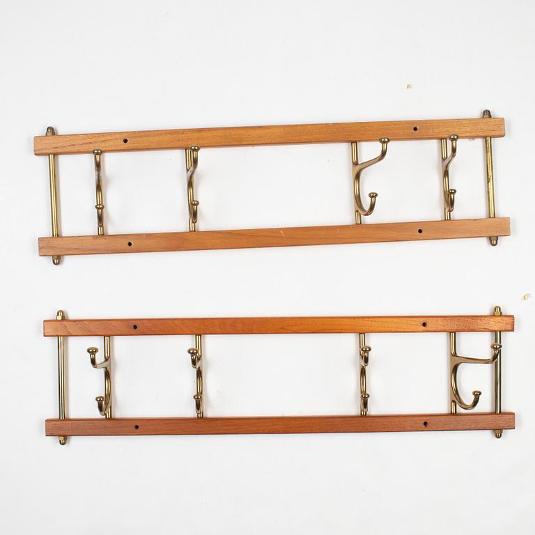 A pair of 'Dekorativ' coat hangers, Skoglunds metallgjuteri, Anderstorp, mid 20th Century.