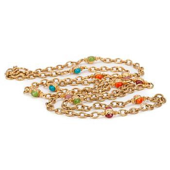 CHANEL, a gold colored long necklace white multicolored glass stones.