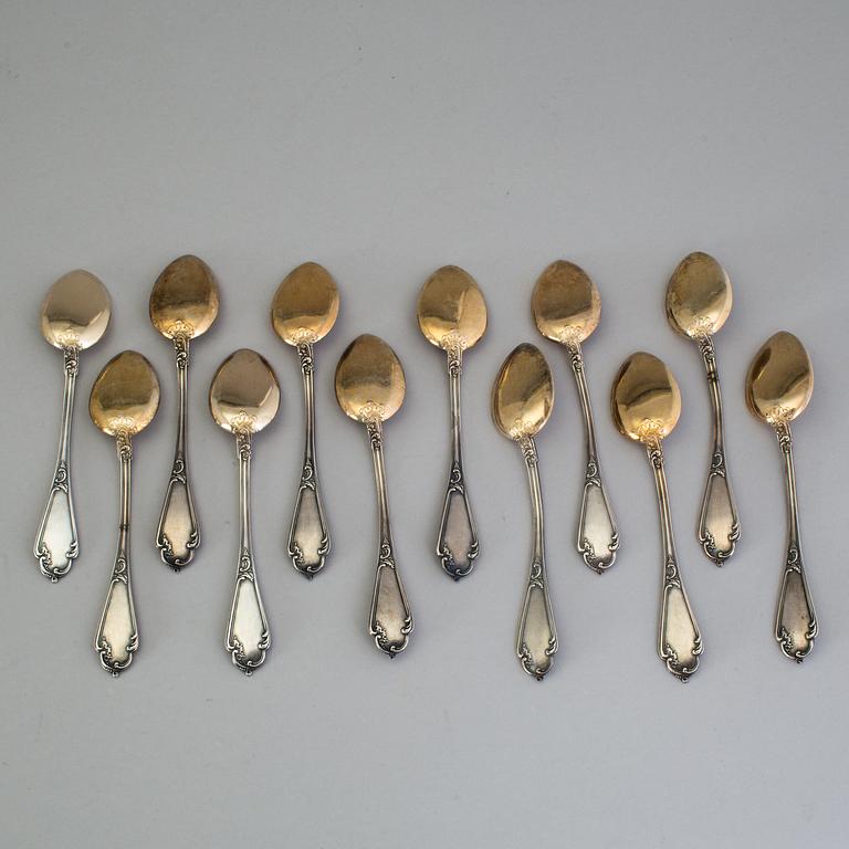 A set of 12 Fabergé parcel-gilt caviar-spoons, Moscow 1899-1908.