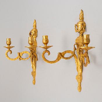 A pair of wall sconces, Louis XVI style, early 20th century.