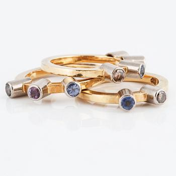 Three multicolored sapphire and brilliant cut diamond rings.