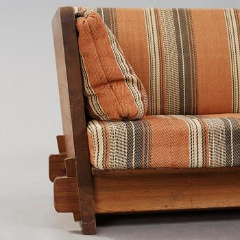 An Axel Einar Hjorth stained pine 'Lovö' sofa, Nordiska Kompaniet, Sweden ca 1930.