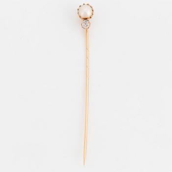 A TIE-PIN, 14K gold with a natural pearl and an old cut diamond.