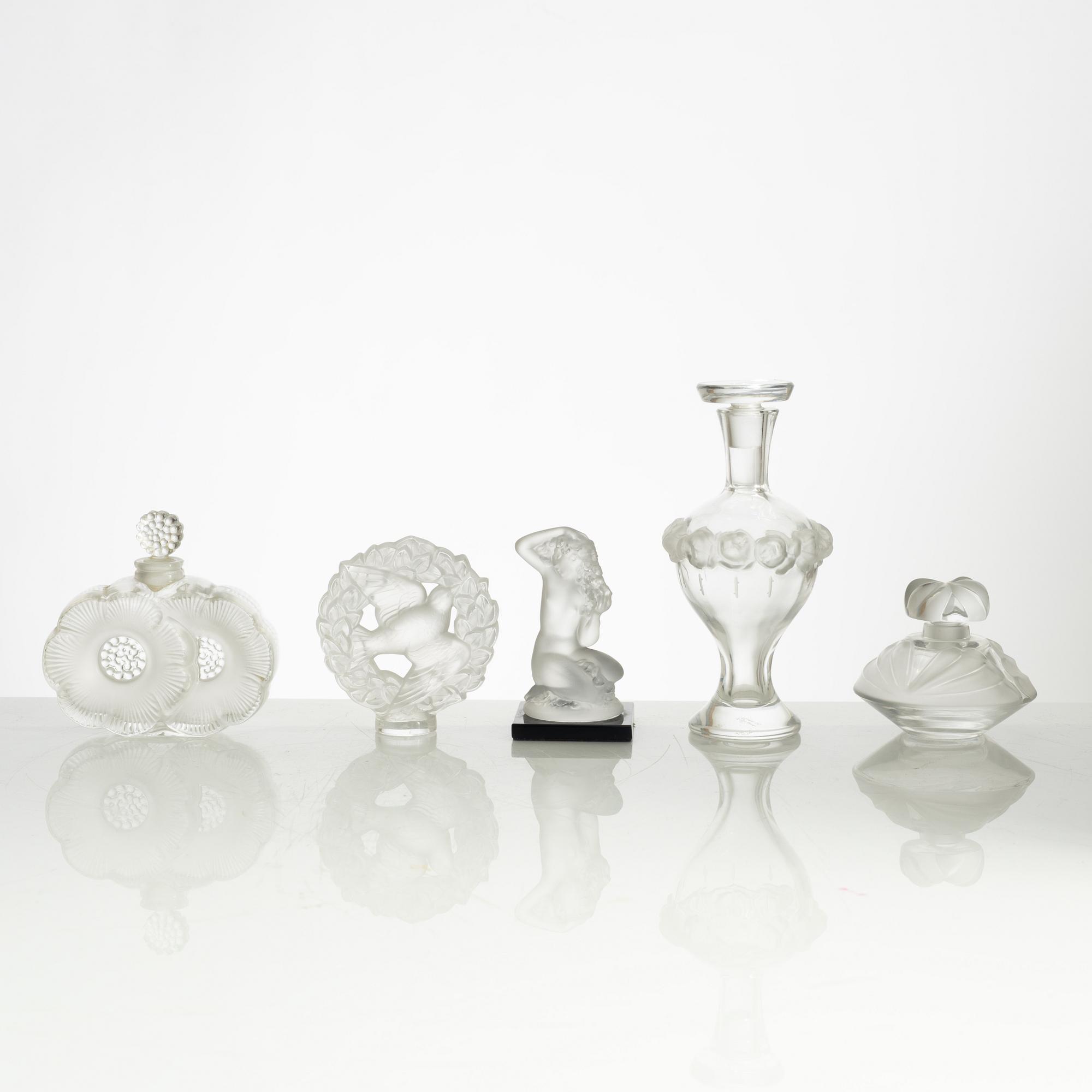 Lalique, four perfume bottles and five figurines, France, after 1945.