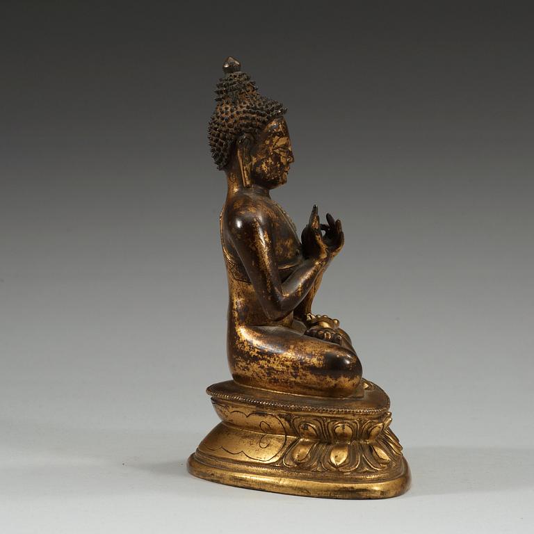 A gilt bronze figure of Buddha, Sinotibetan, 18th Century.