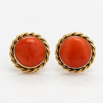A pair of 18K gold earrings with coral.
