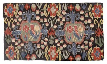 A carriage cushion, "Den innelykta fågeln"  tapestry weave, c. 54 x 87 cm, around 1800.