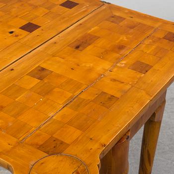 An end of the 19th Century Queen Anne-style card table.