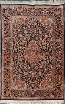 An oriental carpet. Circa 183x122 cm.