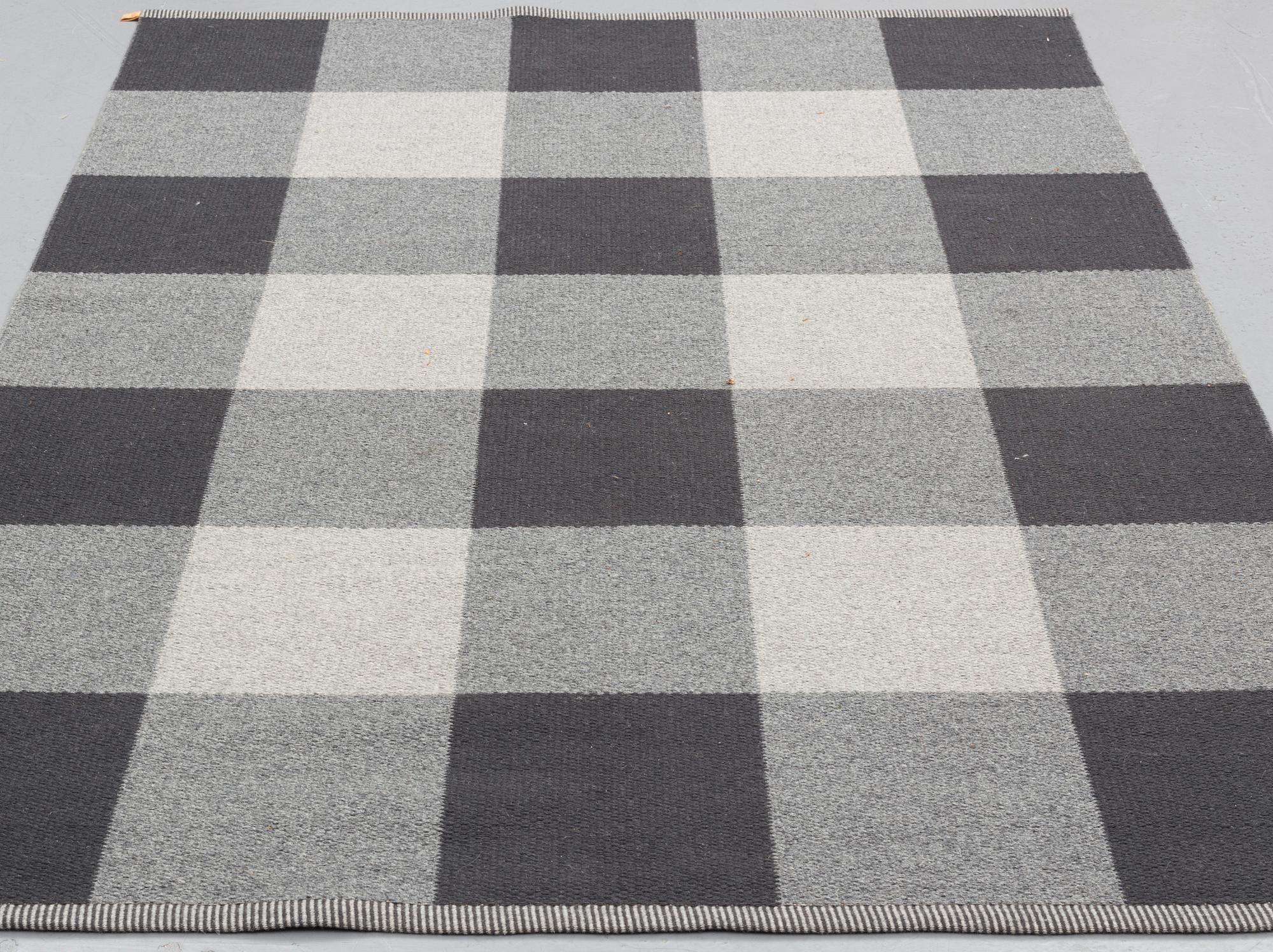 A mashine woven carpet, "Checkerboard", designed by Gunilla Lagerhem-Ullberg, Kasthall, around 246 x 163 cm.