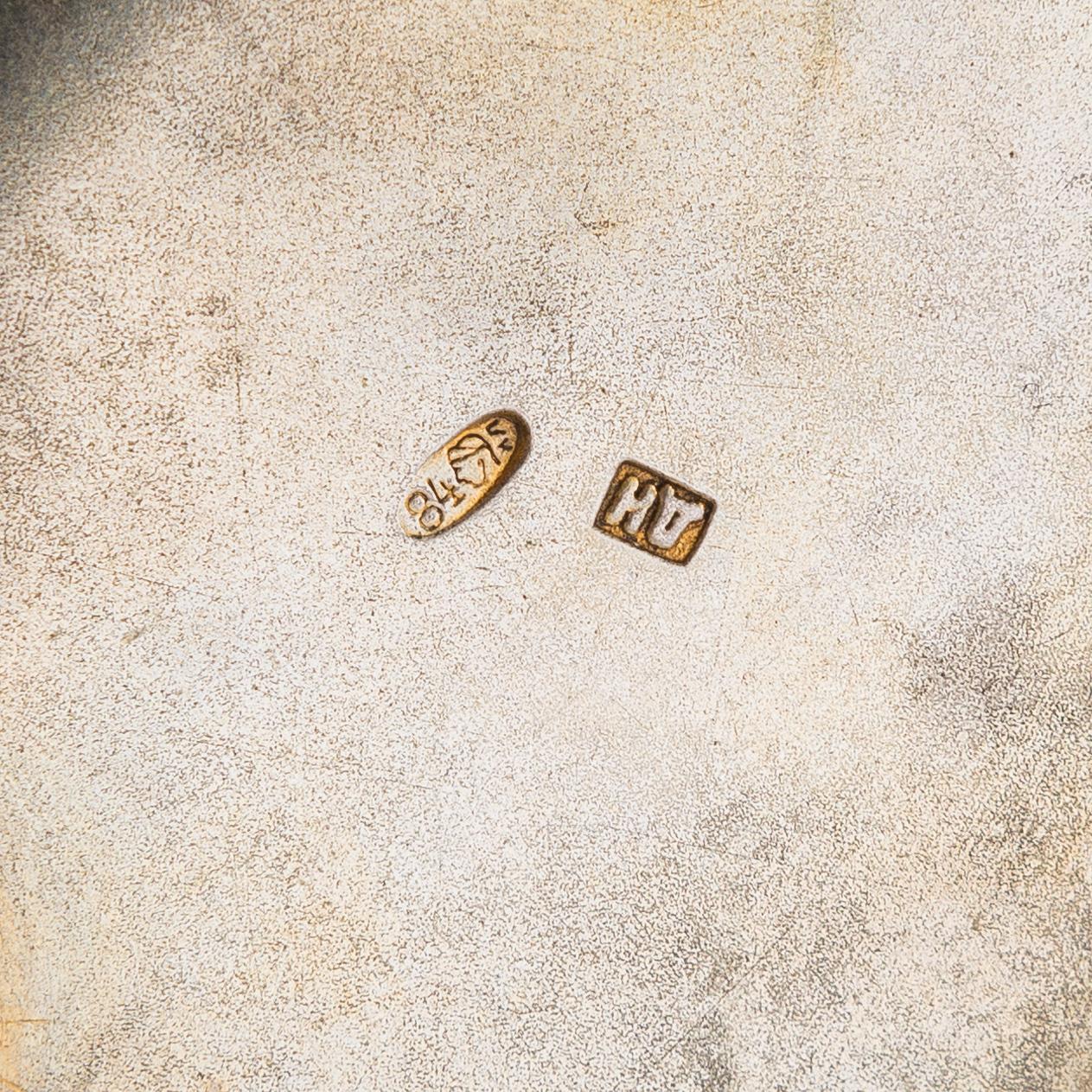 A salt cellar, mark of D. Nikitin, and 2 spoons, poss. P. Abrosimov and M. Andreyevna, enamel, silver. Moscow 1899-1908.