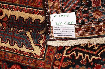 A carpet, semi-antique Heris, approx. 360 x 260 cm.