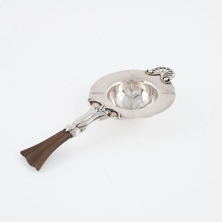 Georg Jensen, silver tea strainer, Copenhagen, Denmark.