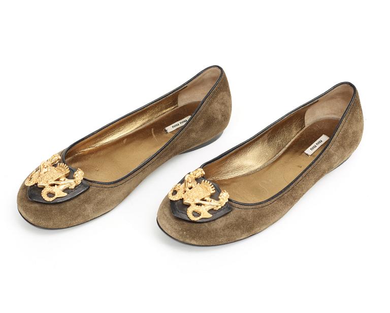 A pair of ballerina shoes by Miu Miu.