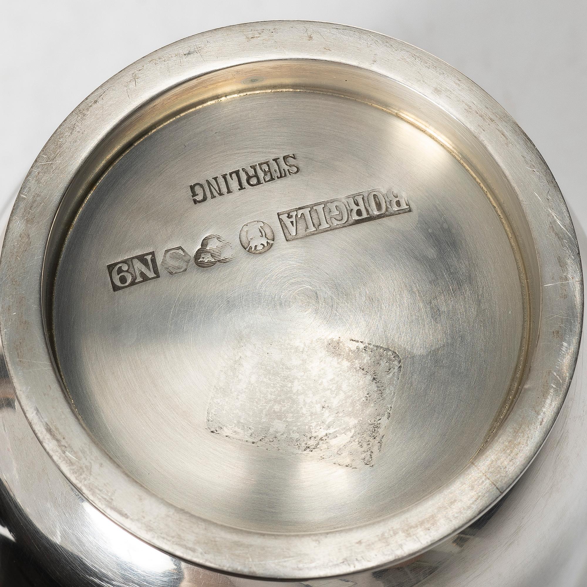 A silver vase and two bowls, Jacob Ängman, Eric Löfman, and Borgila respectively.