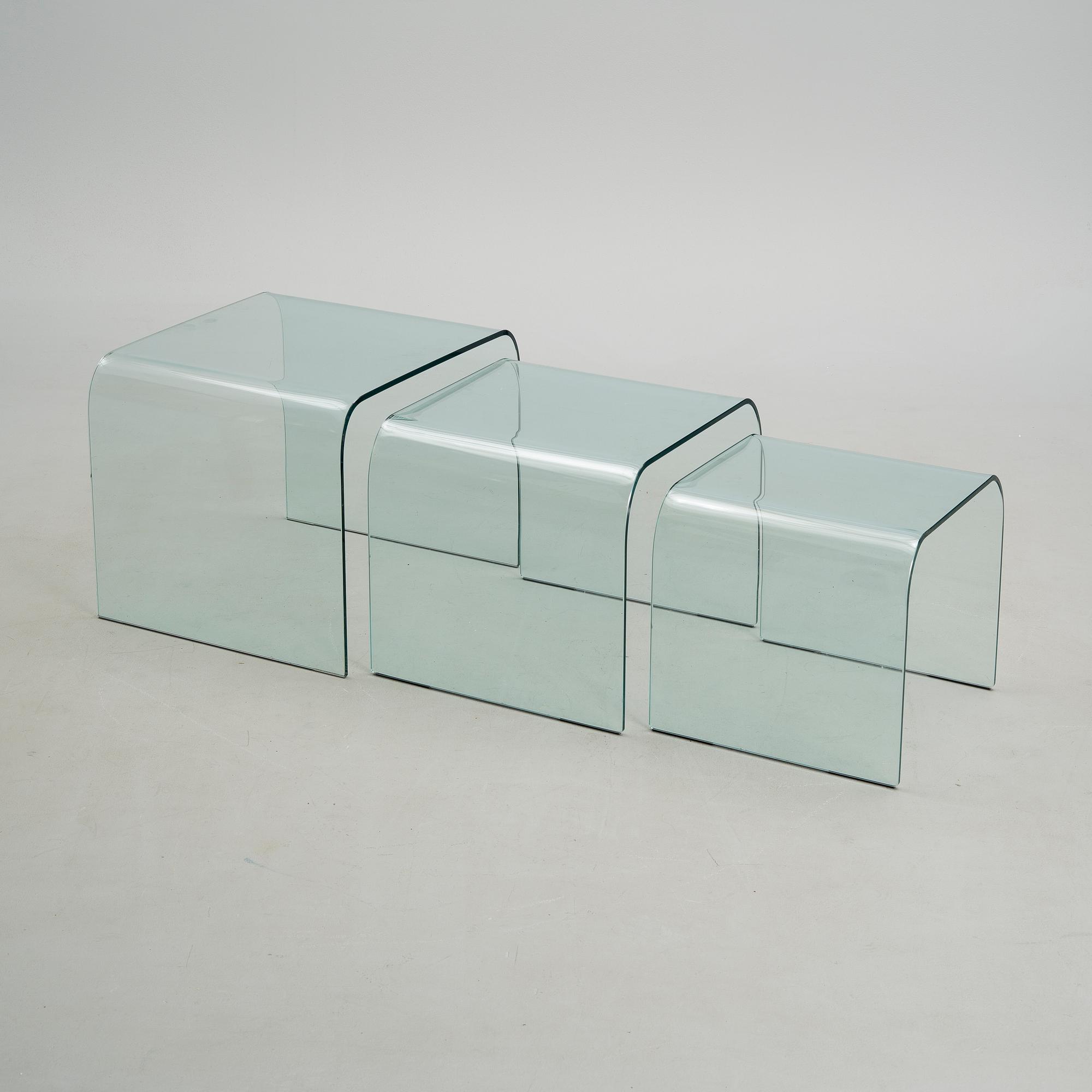 A GLASS NEST TABLE / GLASS COFFEE TABLE, "Eclipse" Ligne Roset, retailer Skanno Finland late 20th century.