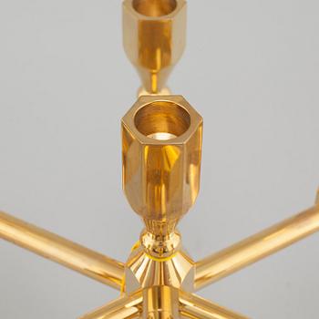 A pair of similar brass candelabras from Gusum, second half of the 20th century.