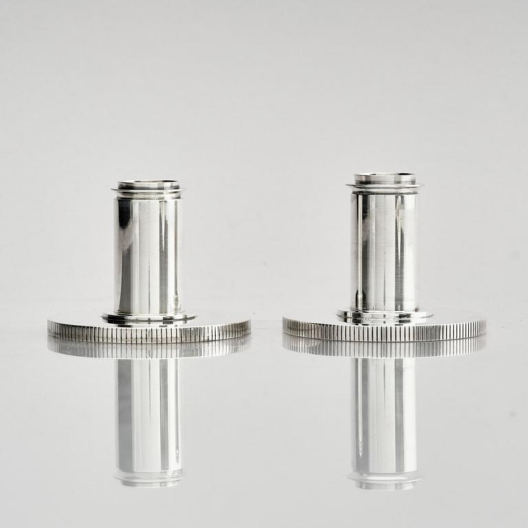 Georg Jensen, a pair of sterling silver candlesticks, design by Sigvard Bernadotte, model no 711A, Copenhagen, Denm after 1945.