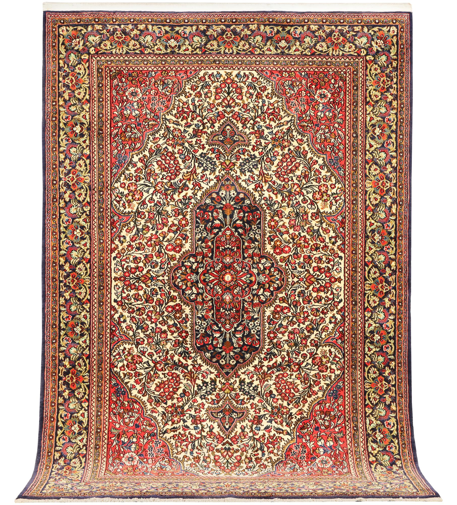 A Ghom rug, c. 202 x 137 cm.