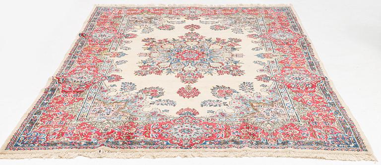 A carpet, old Kerman, approx. 314 x 210 cm.