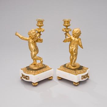 A PAIR OF GILT CANDLESTICKS, gilt bronze and white marble, sign CH, late 19th century.