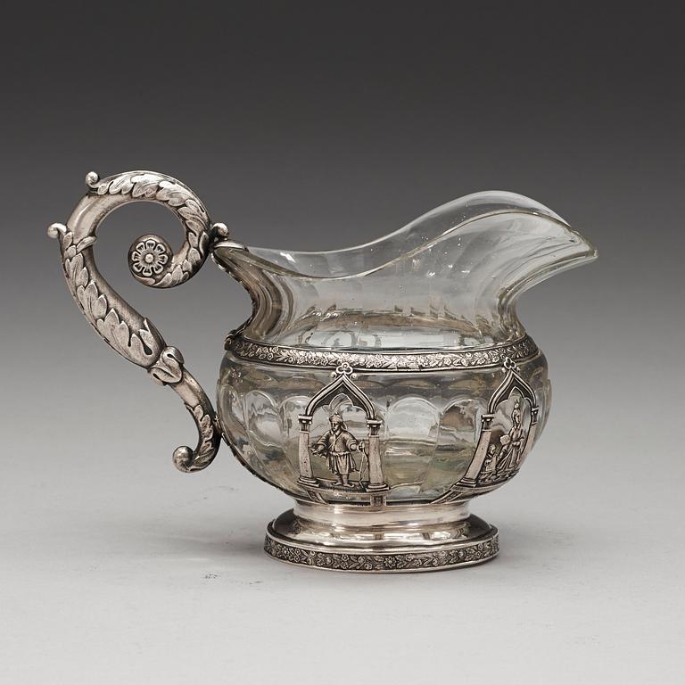 A Russian 19th century glass and silver cream-jug, unidentified makers mark, St. Petersburg 1834.