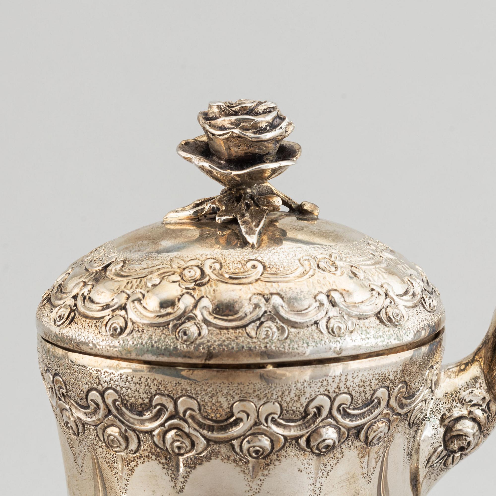 A rococo-style coffee pot, creamer and sugar bowl, swedish import mark, 20th century.