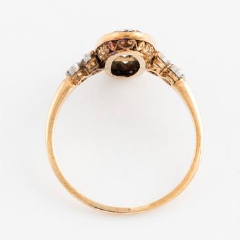 An 18K gold and ring set with old-cut diamonds and step-cut sapphires.