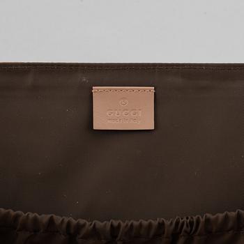 Gucci, skötväska.