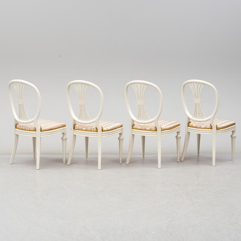 Four chairs with dinner table, late 20th Century.