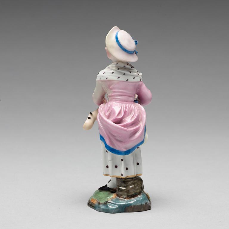 A porcelainfigure of a female musician, "Höchst mark", circa 1900.