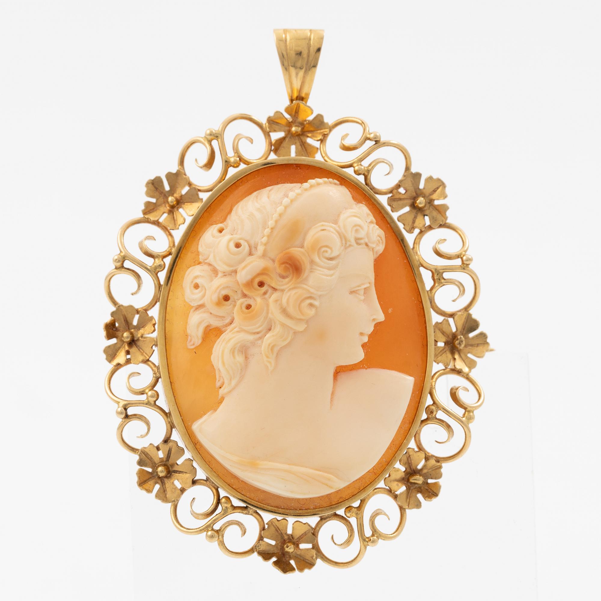 Pendant/brooch in 18K gold with a shell cameo.