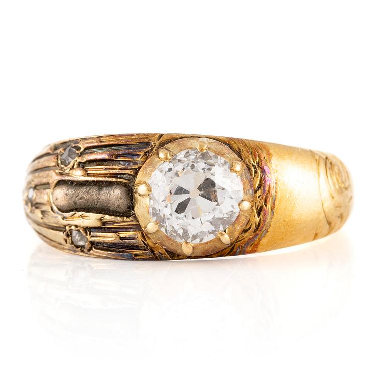 A ring in 18K gold set with an old-cut diamond.