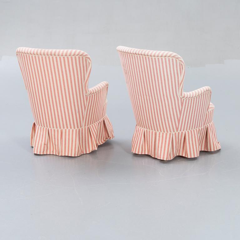 A pair of Modern easy chairs.