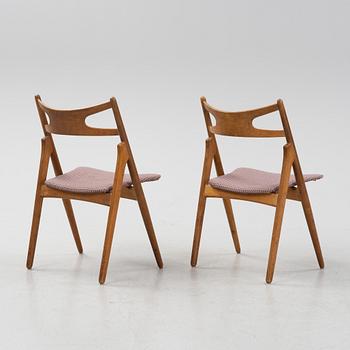 A set of six model CH 29 'Savbukstolen' by Hans J Wegner, designed 1952.