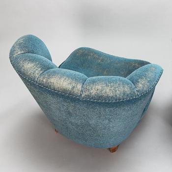 A pair of mid-20th-century armchairs.