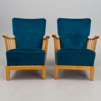 A pair of mid 20th century '2402 Armi' armchairs by Ilmari Lappalainen/Olavi Lieto, Asko, Finland.