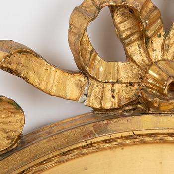A Gustavian style mirror, first half of the 20th century.