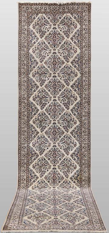 A Nain part silk carpet, 408 x 98 cm.
