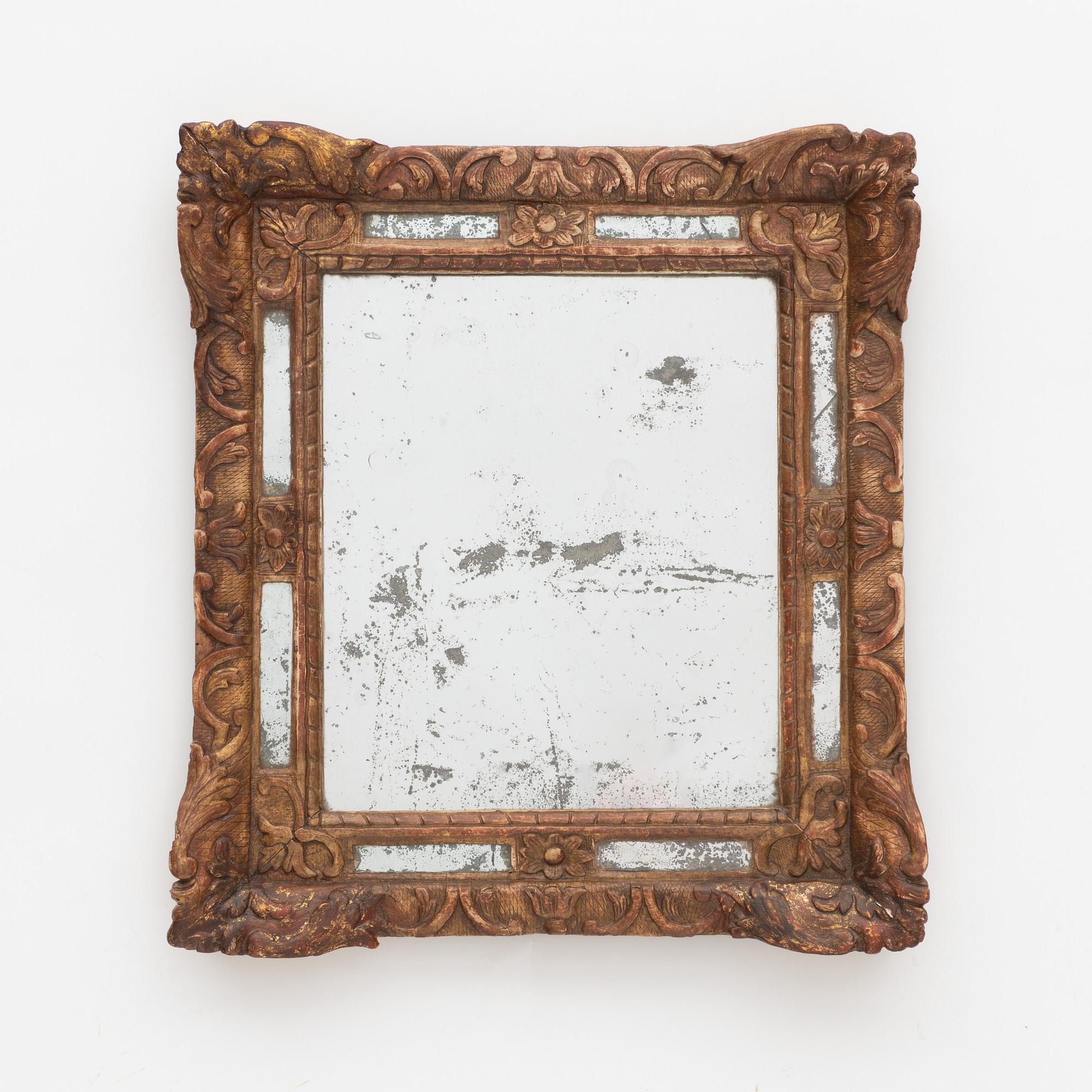 A Baroque mirror, France, 18th Century.