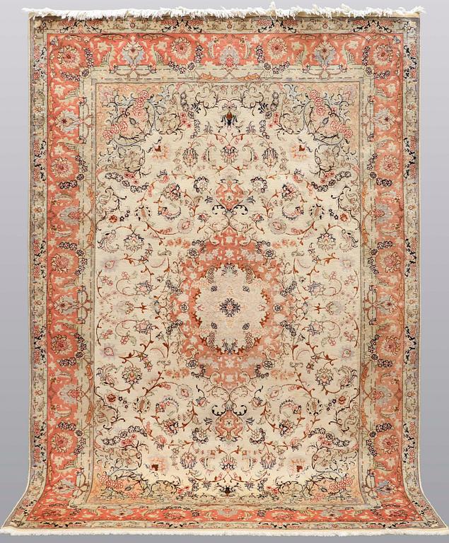 A carpet, Tabriz part silk, ca 302 x 200 cm.