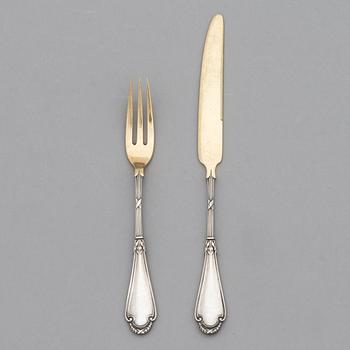 A set of Fabergé parcel-gilt silver dessert cutlery, 11 pieces + one fork later manufactured by Kultakeskus, Finland.