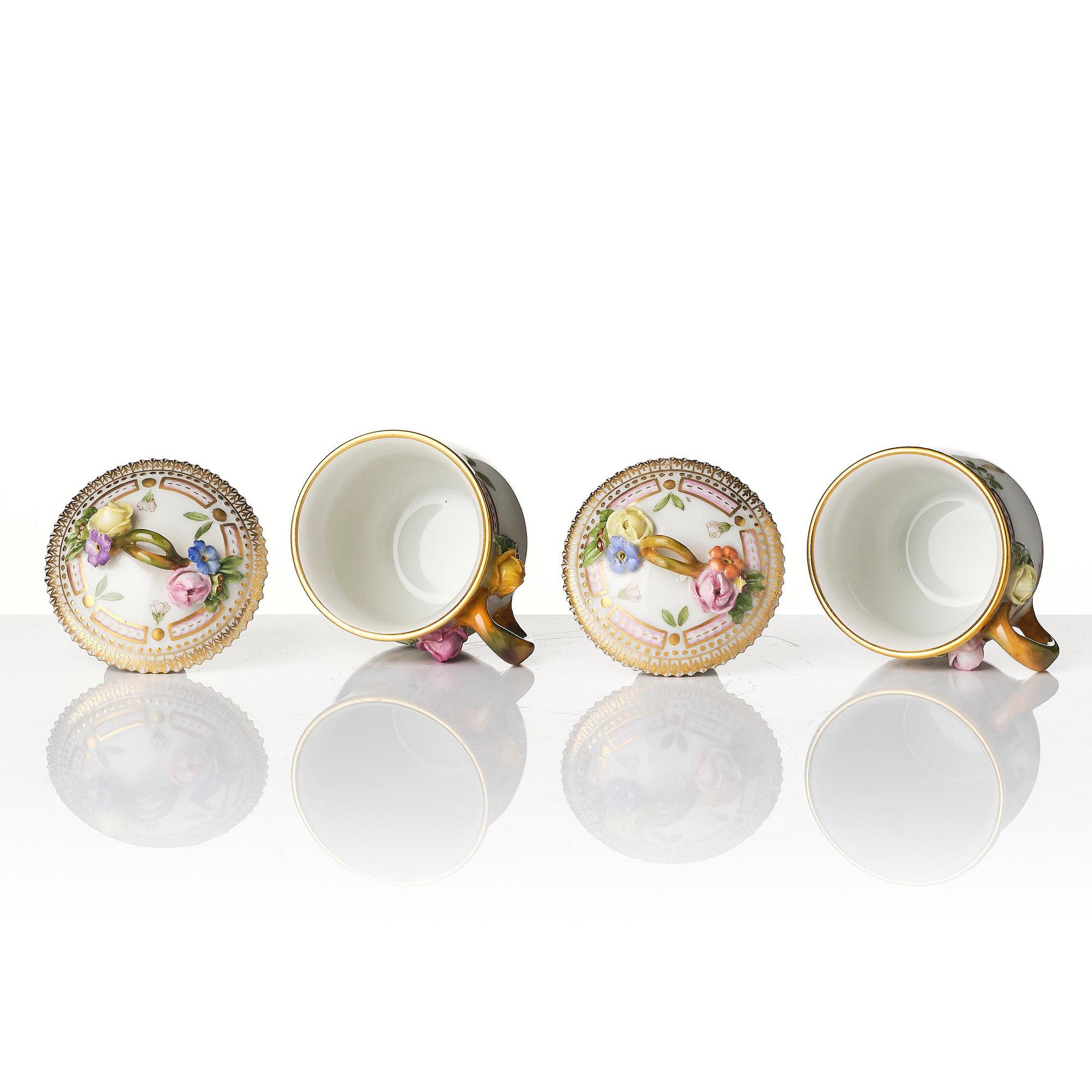 A set with four Royal Copenhagen 'Flora Danica' custard cups with covers and stands, Denmark, 20th century.